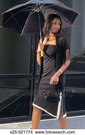 African Woman in Black Dress, City Environment, MR #1027 View Large Photo Image Picture - African Woman in Black Dress, City Environment, MR #1027. Fotosearch