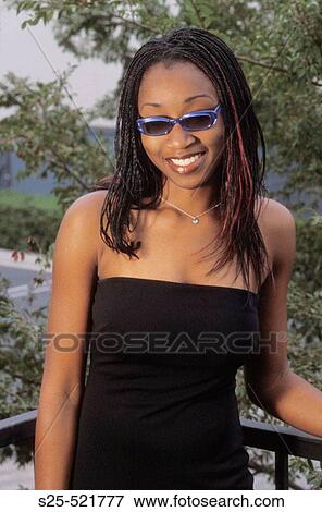 Stock Photo - African Woman in Black Dress, City Environment, MR #1027. Fotosearch