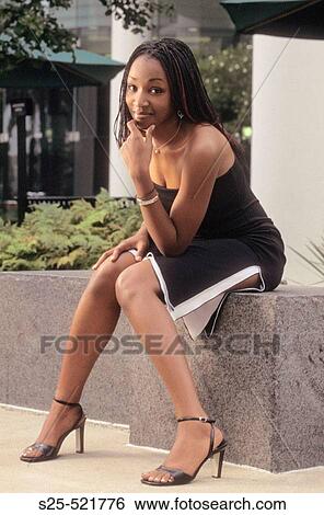 African Woman in Black Dress, City Environment, MR #1027 View Large Photo Image Stock Photograph - African Woman in Black Dress, City Environment, MR #1027. Fotosearch