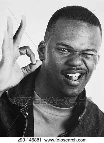 Afro-Amer Man makes A. O. K. gesture View Large Photo Image Stock Image - Afro-Amer Man makes A. O. K. gesture. Fotosearch