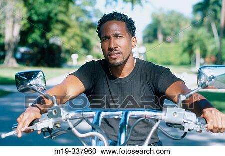 Afro-Amer. man on motorcycle View Large Photo Image Stock Image - Afro-Amer. man on motorcycle. Fotosearch