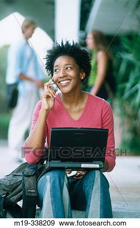 Afro-Amer, student with laptop and cellular View Large Photo Image Stock Photo - Afro-Amer, student with laptop and cellular. Fotosearch