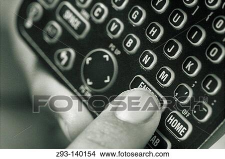 Afro-american man's hand holds electronic diary View Large Photo Image Picture - Afro-american man's hand holds electronic diary. Fotosearch