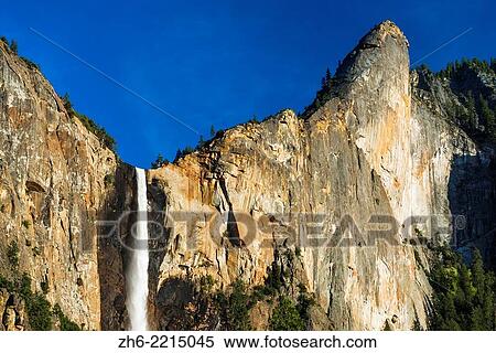 Stock Photography - Afternoon light on Bridalveil Fall, Yosemite National Park, California USA.. Fotosearch