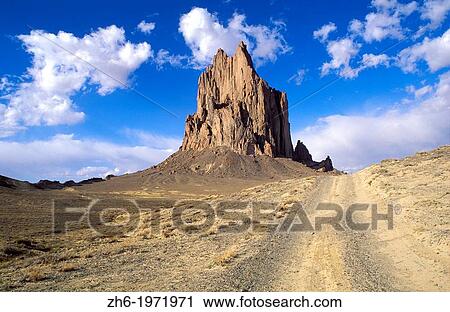 Afternoon light on Shiprock and dirt road, Navajo Indian Reservation, New Mexico USA. View Large Photo Image Stock Image - Afternoon light on Shiprock and dirt road, Navajo Indian Reservation, New Mexico USA.. Fotosearch