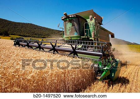 Agricultural machinery Combine harvester on field of wheat? Learza? estate Near Estella, Navarre, Spain View Large Photo Image Stock Image - Agricultural machinery Combine harvester on field of wheat? Learza? estate Near Estella, Navarre, Spain. Fotosearch