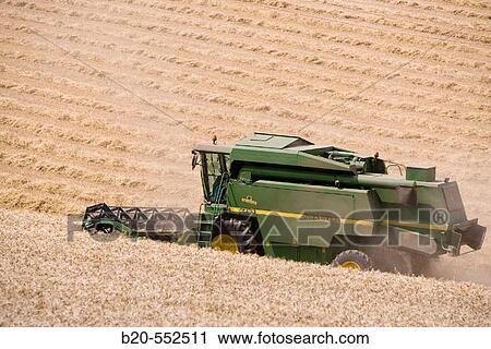 Agricultural machinery. Combine harvester on field of wheat.? Learza? estate. Near Estella, Navarre, Spain View Large Photo Image Stock Image - Agricultural machinery. Combine harvester on field of wheat.? Learza? estate. Near Estella, Navarre, Spain. Fotosearch