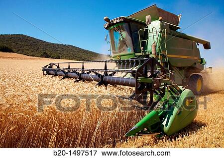 Agricultural machinery Combine harvester on field of wheat? Learza? estate Near Estella, Navarre, Spain View Large Photo Image Stock Photo - Agricultural machinery Combine harvester on field of wheat? Learza? estate Near Estella, Navarre, Spain. Fotosearch