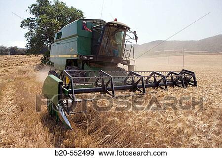 Agricultural machinery. Combine harvester on field of wheat.? Learza? estate. Near Estella, Navarre, Spain View Large Photo Image Stock Photo - Agricultural machinery. Combine harvester on field of wheat.? Learza? estate. Near Estella, Navarre, Spain. Fotosearch