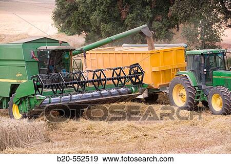 Agricultural machinery. Combine harvester on field of wheat.? Learza? estate. Near Estella, Navarre, Spain View Large Photo Image Stock Photo - Agricultural machinery. Combine harvester on field of wheat.? Learza? estate. Near Estella, Navarre, Spain. Fotosearch