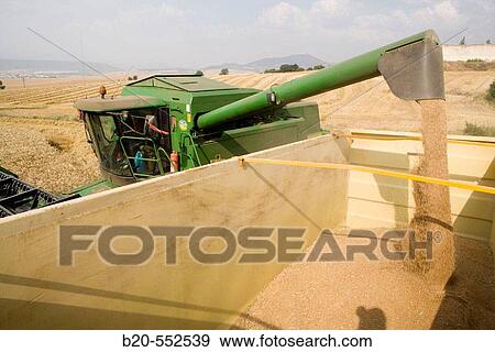 Stock Photo - Agricultural machinery. Combine harvester on field of wheat.? Learza? estate. Near Estella, Navarre, Spain. Fotosearch