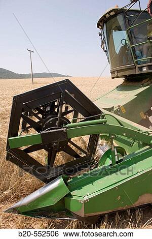 Agricultural machinery. Combine harvester on field of wheat.? Learza? estate. Near Estella, Navarre, Spain View Large Photo Image Stock Photograph - Agricultural machinery. Combine harvester on field of wheat.? Learza? estate. Near Estella, Navarre, Spain. Fotosearch
