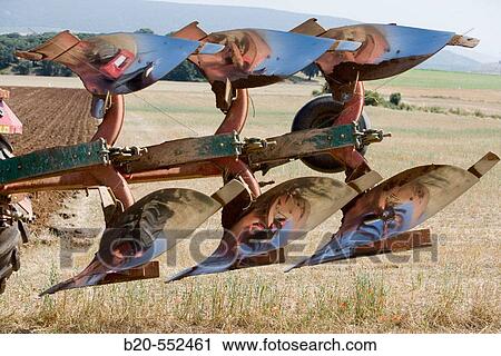 Agricultural machinery. Mouldboard plough. Harvesting of cereals, Oco (near Estella), Navarre, Spain View Large Photo Image Stock Image - Agricultural machinery. Mouldboard plough. Harvesting of cereals, Oco (near Estella), Navarre, Spain. Fotosearch