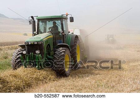 Agricultural machinery. Pick-up baler. Harvesting of cereals,? Learza? estate. Near Estella, Navarre, Spain View Large Photo Image Stock Photo - Agricultural machinery. Pick-up baler. Harvesting of cereals,? Learza? estate. Near Estella, Navarre, Spain. Fotosearch