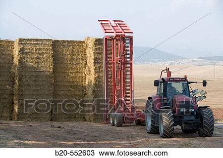 Agricultural machinery. Truck elevator with bales. Harvesting of cereals.?Learza? estate. Near Estella, Navarre, Spain View Large Photo Image Stock Image - Agricultural machinery. Truck elevator with bales. Harvesting of cereals.?Learza? estate. Near Estella, Navarre, Spain. Fotosearch