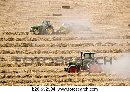 Agricultural machinery. Windrower and Pick-up baler. Harvesting of cereals,? Learza? estate. Near Estella, Navarre, Spain View Large Photo Image Picture - Agricultural machinery. Windrower and Pick-up baler. Harvesting of cereals,? Learza? estate. Near Estella, Navarre, Spain. Fotosearch