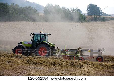 Agricultural machinery. Windrower. Harvesting of cereals,? Learza? estate. Near Estella, Navarre, Spain View Large Photo Image Picture - Agricultural machinery. Windrower. Harvesting of cereals,? Learza? estate. Near Estella, Navarre, Spain. Fotosearch