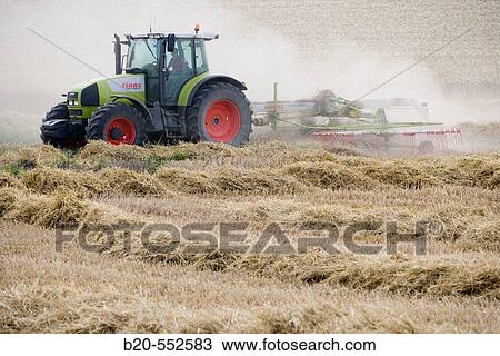 Agricultural machinery. Windrower. Harvesting of cereals,? Learza? estate. Near Estella, Navarre, Spain View Large Photo Image Stock Image - Agricultural machinery. Windrower. Harvesting of cereals,? Learza? estate. Near Estella, Navarre, Spain. Fotosearch