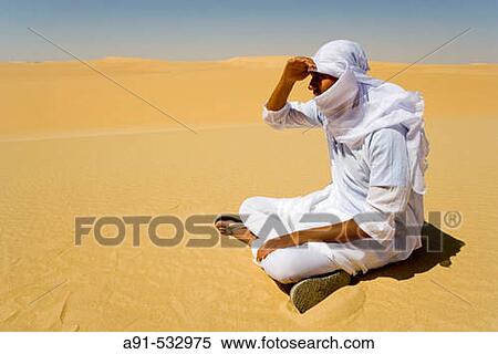 Ahmed Hussein in the desert and Great Sand Sea between Siwa and Bahariya oasis (450km). Libyan desert. Egypt View Large Photo Image Stock Photography - Ahmed Hussein in the desert and Great Sand Sea between Siwa and Bahariya oasis (450km). Libyan desert. Egypt. Fotosearch