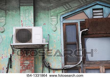 Air conditioning in a Thai house wall View Large Photo Image Picture - Air conditioning in a Thai house wall. Fotosearch