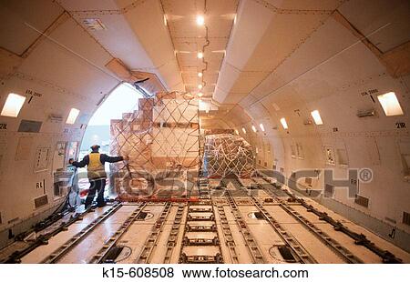 Air freight being unloaded from Boeing 747 aircraft View Large Photo Image Stock Photo - Air freight being unloaded from Boeing 747 aircraft. Fotosearch