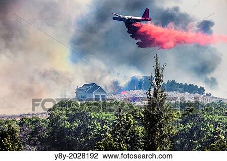 Airplane drops fire retardant on homes in Utah neighborhood. View Large Photo Image Stock Image - Airplane drops fire retardant on homes in Utah neighborhood.. Fotosearch