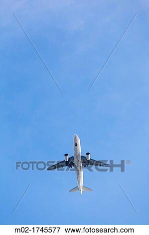 Airplane flying in Lisbon, Portugal, Europe View Large Photo Image Stock Photo - Airplane flying in Lisbon, Portugal, Europe. Fotosearch