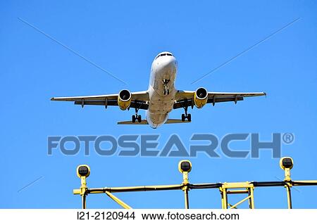 Airplane landing. Barcelona, Catalonia, Spain. View Large Photo Image Picture - Airplane landing. Barcelona, Catalonia, Spain.. Fotosearch