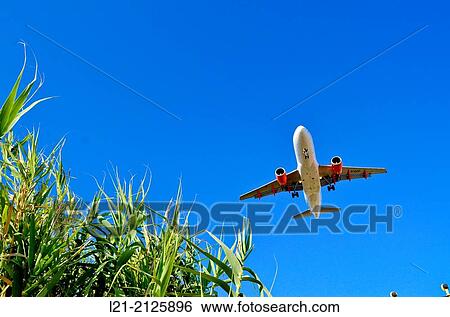 Airplane landing. Barcelona, Catalonia, Spain. View Large Photo Image Stock Photograph - Airplane landing. Barcelona, Catalonia, Spain.. Fotosearch