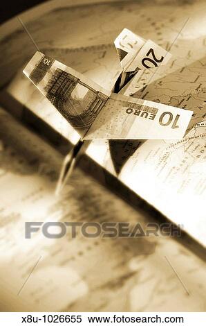 Airplane made of Euro notes resting on Atlas View Large Photo Image Stock Photography - Airplane made of Euro notes resting on Atlas. Fotosearch