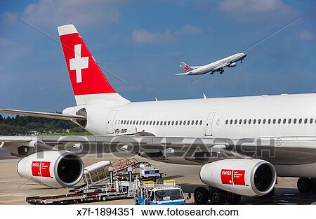 Airplanes in Zurich Airport, Zurich, Switzerland, Europe View Large Photo Image Stock Image - Airplanes in Zurich Airport, Zurich, Switzerland, Europe. Fotosearch