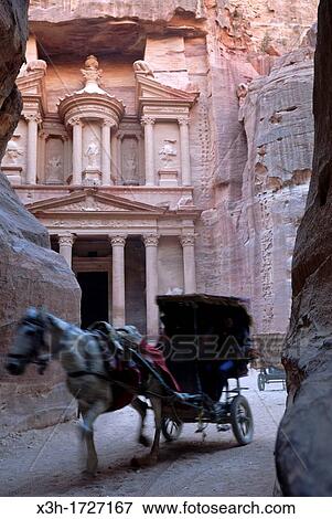 Al Khazneh, Petra's most elaborate ruin, seen from the narrow gorge Siq, Jordan, Middle East, Asia View Large Photo Image Stock Photo - Al Khazneh, Petra's most elaborate ruin, seen from the narrow gorge Siq, Jordan, Middle East, Asia. Fotosearch