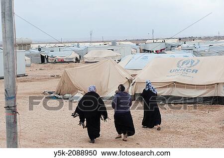 Stock Image - Al Za? atari, Al Mafraq region, Jordan, Middle-East. Every single day new people and families arrive in the UNHCR refugee camp Al Za? atari.. Fotosearch