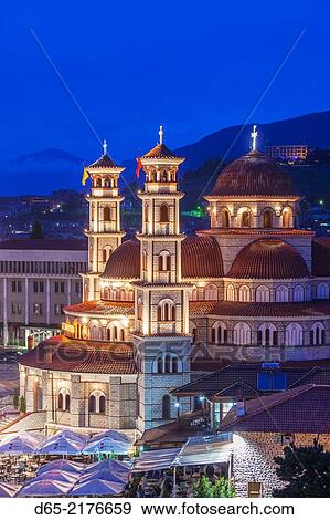 Albania, Korca, the Orthodox Cathedral, elevated view along the Boulevard Republika, dusk. View Large Photo Image Stock Photo - Albania, Korca, the Orthodox Cathedral, elevated view along the Boulevard Republika, dusk.. Fotosearch