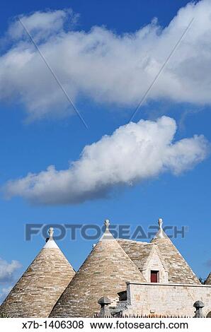 Alberobello Puglia Italy Conical shaped rooftops of a trullo in the countryside between Locorotondo and Alberobello View Large Photo Image Stock Photo - Alberobello Puglia Italy Conical shaped rooftops of a trullo in the countryside between Locorotondo and Alberobello. Fotosearch