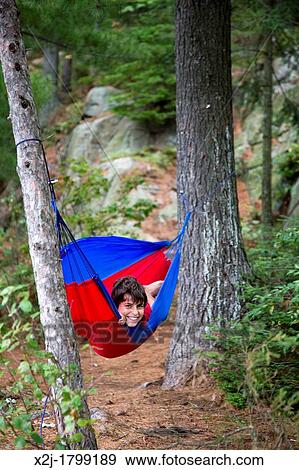 Algonquin Provincial Park, Ontario Canada - Joey West, 13, in a hammock at a backcountry campsite View Large Photo Image Stock Photo - Algonquin Provincial Park, Ontario Canada - Joey West, 13, in a hammock at a backcountry campsite. Fotosearch