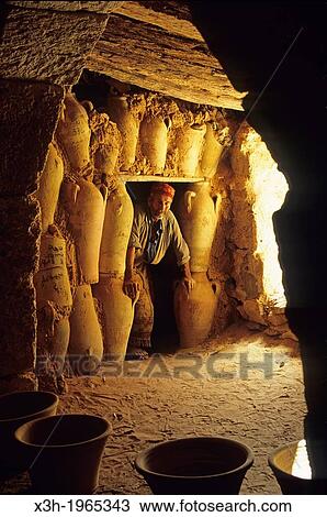 Stock Image - Ali Mimoun in his pottery at Guellala, Djerba island, Tunisia, North Africa.. Fotosearch