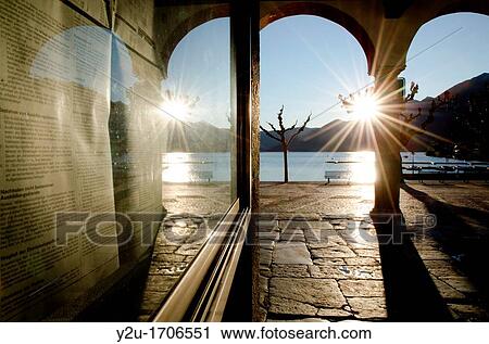 Alley in backlight and reflected in a window View Large Photo Image Stock Image - Alley in backlight and reflected in a window. Fotosearch