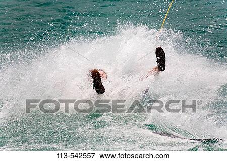 Almost submerged wakeboarder in a splash of water View Large Photo Image Stock Photo - Almost submerged wakeboarder in a splash of water. Fotosearch