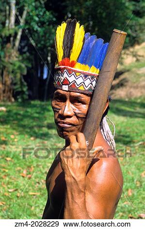 AMAZON RIVER, PORTRAIT OF BORA INDIAN MAN WITH COLORFUL PARROT FEATHER HEADDRESS. View Large Photo Image Stock Photo - AMAZON RIVER, PORTRAIT OF BORA INDIAN MAN WITH COLORFUL PARROT FEATHER HEADDRESS.. Fotosearch