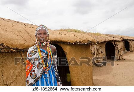 Amboseli National Park Kenya Africa safari Masai woman welcome to village Amboseli Maasai, hut, mud, home, beads, red, color, 1 View Large Photo Image Picture - Amboseli National Park Kenya Africa safari Masai woman welcome to village Amboseli Maasai, hut, mud, home, beads, red, color, 1. Fotosearch