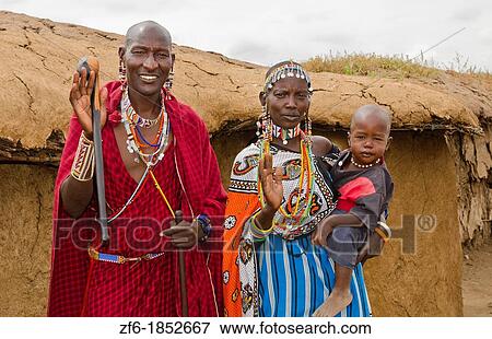 Amboseli National Park Kenya Africa safari Masai couple with child welcome to village Amboseli Maasai, hut, mud, home, beads, red, color, 1 View Large Photo Image Stock Photo - Amboseli National Park Kenya Africa safari Masai couple with child welcome to village Amboseli Maasai, hut, mud, home, beads, red, color, 1. Fotosearch