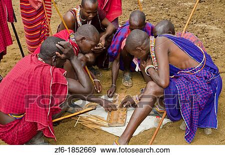 Amboseli National Park Kenya Africa safari Masai men playing Bao game on ground in village Amboseli Maasai, beads, red, color, play, compete, fun, excite, balls, cups, 1 View Large Photo Image Stock Photo - Amboseli National Park Kenya Africa safari Masai men playing Bao game on ground in village Amboseli Maasai, beads, red, color, play, compete, fun, excite, balls, cups, 1. Fotosearch