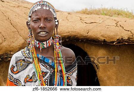 Amboseli National Park Kenya Africa safari Masai woman welcome to village Amboseli Maasai, hut, mud, home, beads, red, color, 1 View Large Photo Image Stock Photograph - Amboseli National Park Kenya Africa safari Masai woman welcome to village Amboseli Maasai, hut, mud, home, beads, red, color, 1. Fotosearch