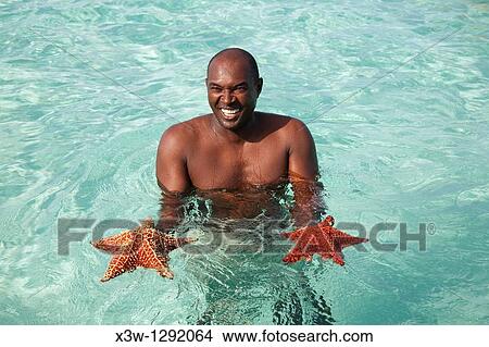 america, caribbean sea, hispaniola island, dominican republic, saona island, caribbean boy View Large Photo Image Picture - america, caribbean sea, hispaniola island, dominican republic, saona island, caribbean boy. Fotosearch