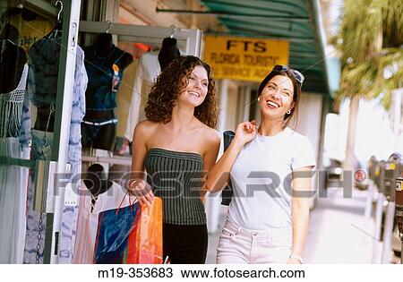 American and columbian friends shopping View Large Photo Image Stock Image - American and columbian friends shopping. Fotosearch