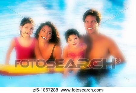 American European family relaxing at home in the pool View Large Photo Image Stock Photo - American European family relaxing at home in the pool. Fotosearch