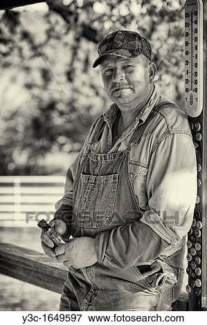 American Farmer Vintage Style Black and White Drinking Whisky from Flask View Large Photo Image Stock Photo - American Farmer Vintage Style Black and White Drinking Whisky from Flask. Fotosearch