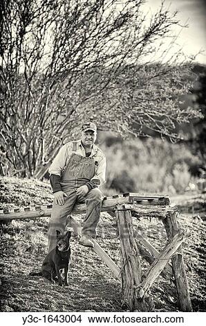 American Farmer with his Dog - Vintage Style Black and White View Large Photo Image Picture - American Farmer with his Dog - Vintage Style Black and White. Fotosearch