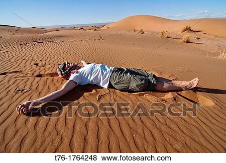 Stock Photo - amidst sand dunes in the Sahara Desert at Erg Chigaga, Morocco. Fotosearch